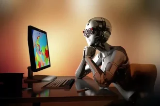 Un robot humanoïde assis devant un ordinateur coloré, symbolisant la dépendance à Internet