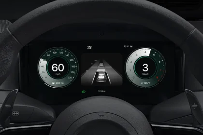 Apple CarPlay Ultra dashboard display with speedometer, ADAS lane view and tachometer inside steering wheel