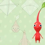 Un Pikmin rouge se tient debout devant des schémas d’origami sur fond vert.